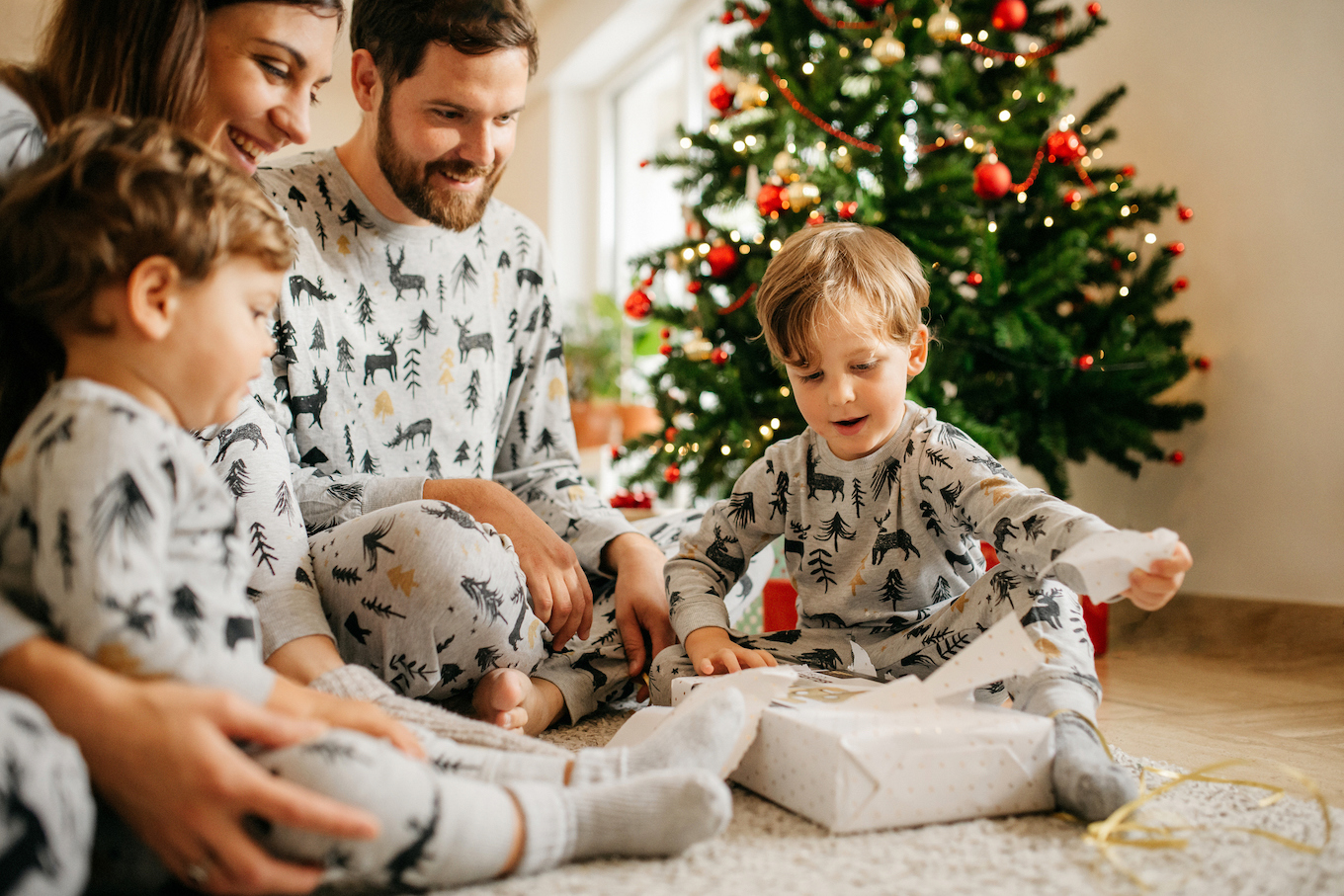 Family opening christmas presents Family opening christmas presents