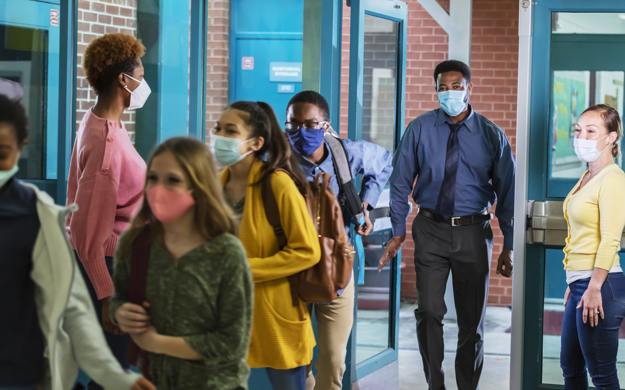 Parents drop middle school students off, with face masks Parents drop middle school students off, with face masks