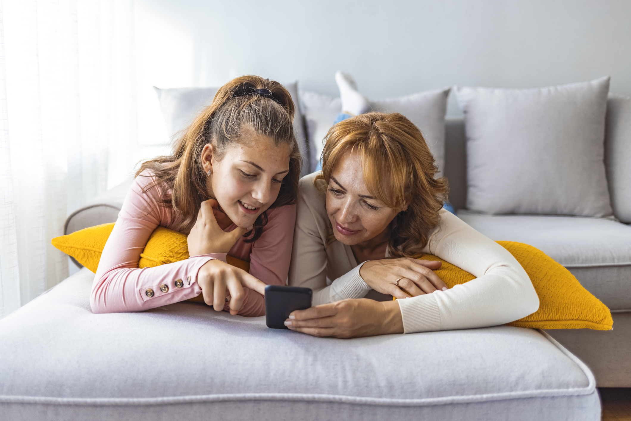 Mother and daughter using a smartphone Mother and daughter using a smartphone