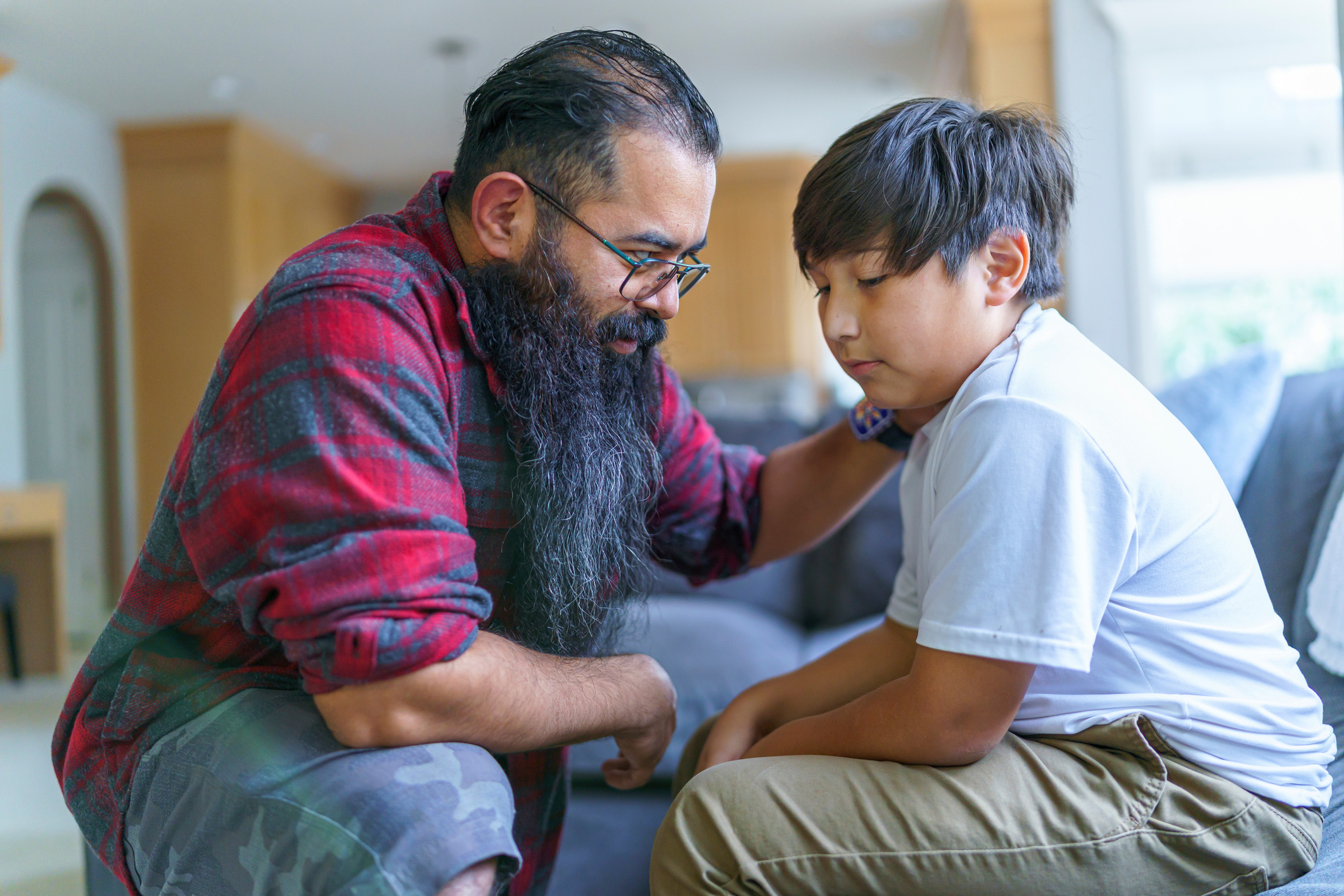 Dad having serious conversation with his son Dad having serious conversation with his son