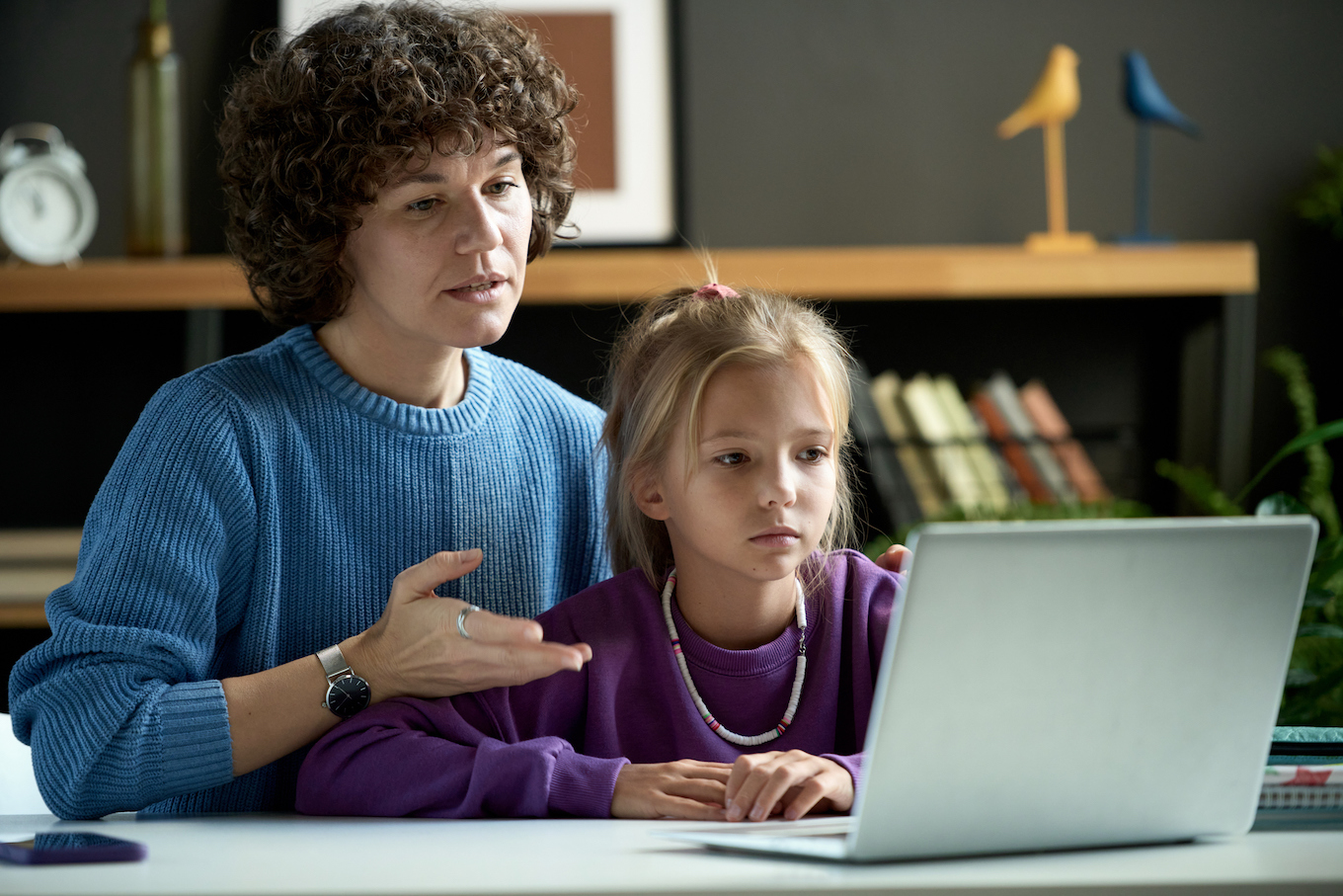 Mom and daughter looking at computer Mom and daughter looking at computer