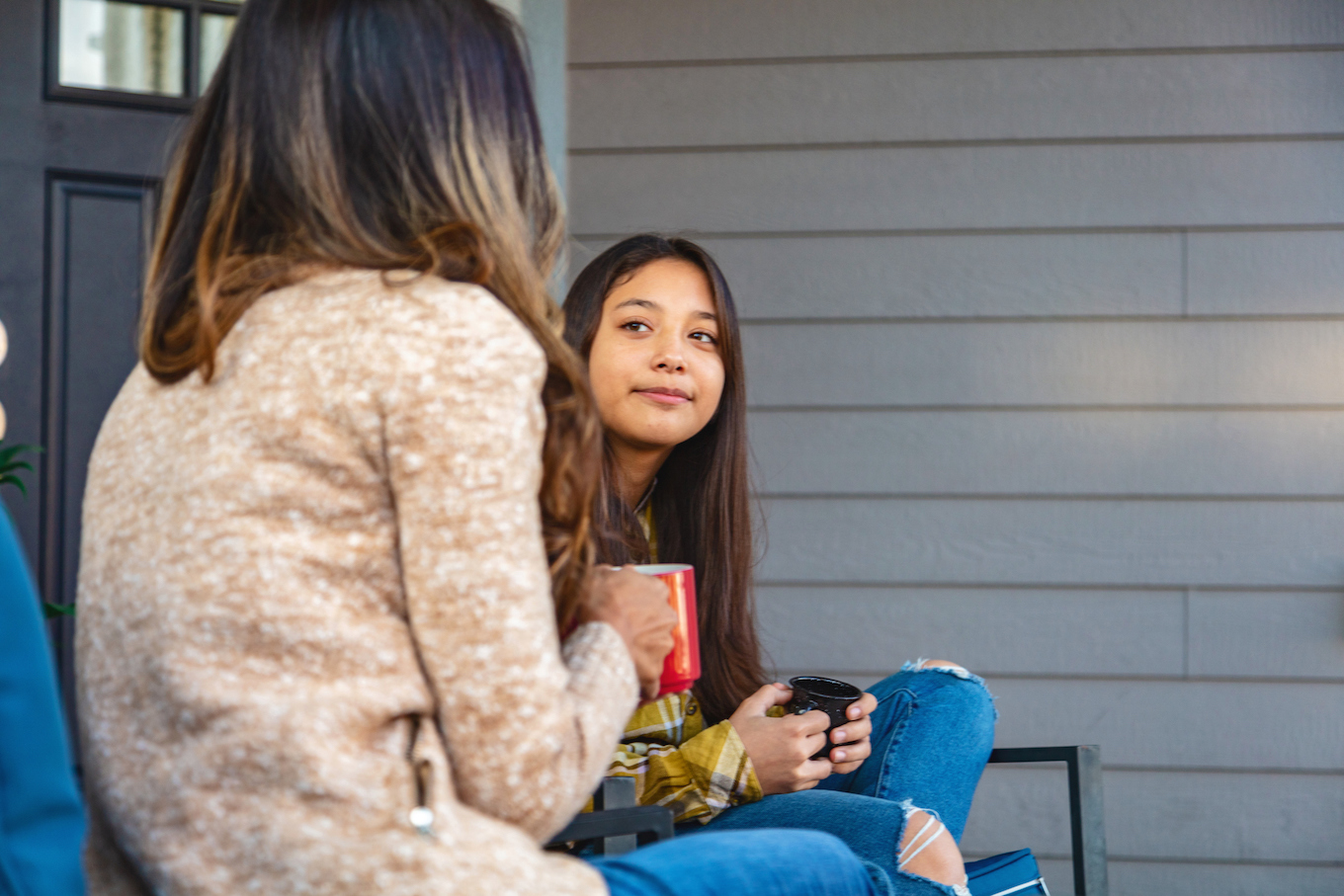 Mom and daughter talking outside Mom and daughter talking outside