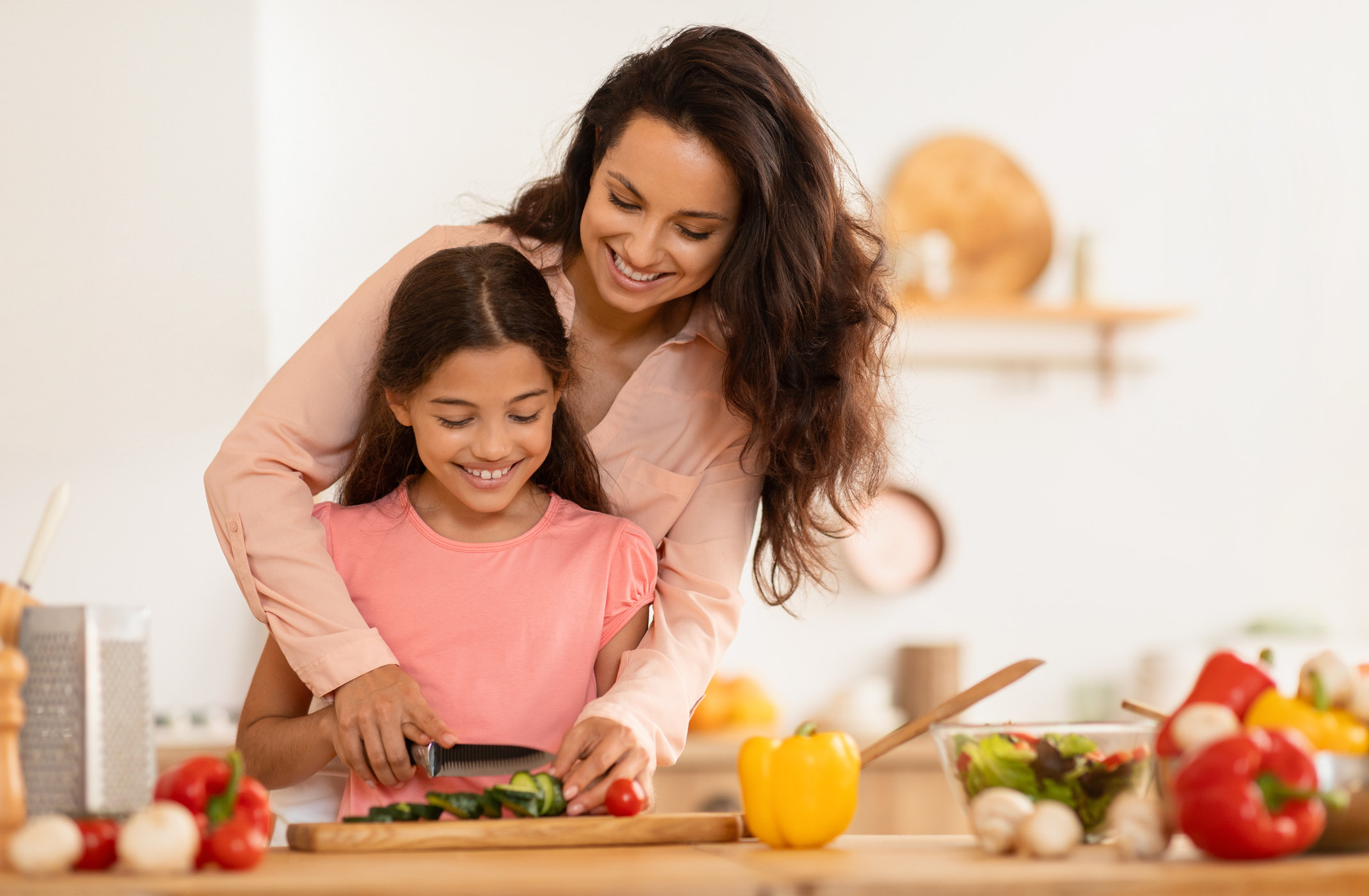 Happy Arab Mom And Daughter Cooking Salad In Modern Kitchen Happy Arab Mom And Daughter Cooking Salad In Modern Kitchen