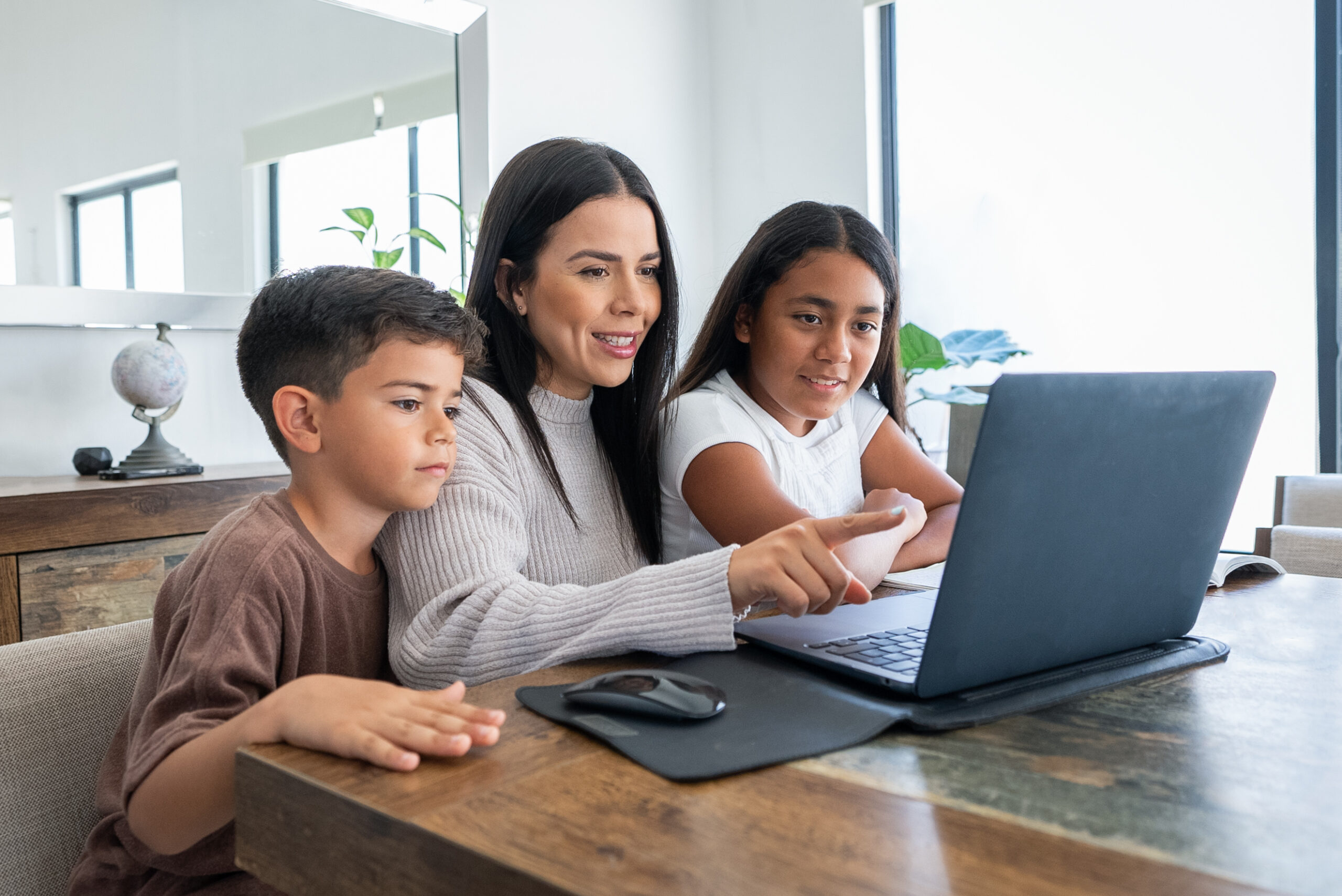 Mexican Family Entertained Using the Laptop, Fun Moment, Modern Life, Technology Mexican Family Entertained Using the Laptop, Fun Moment, Modern Life, Technology
