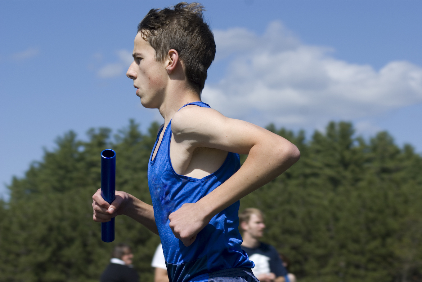 boy running with a baton boy running with a baton