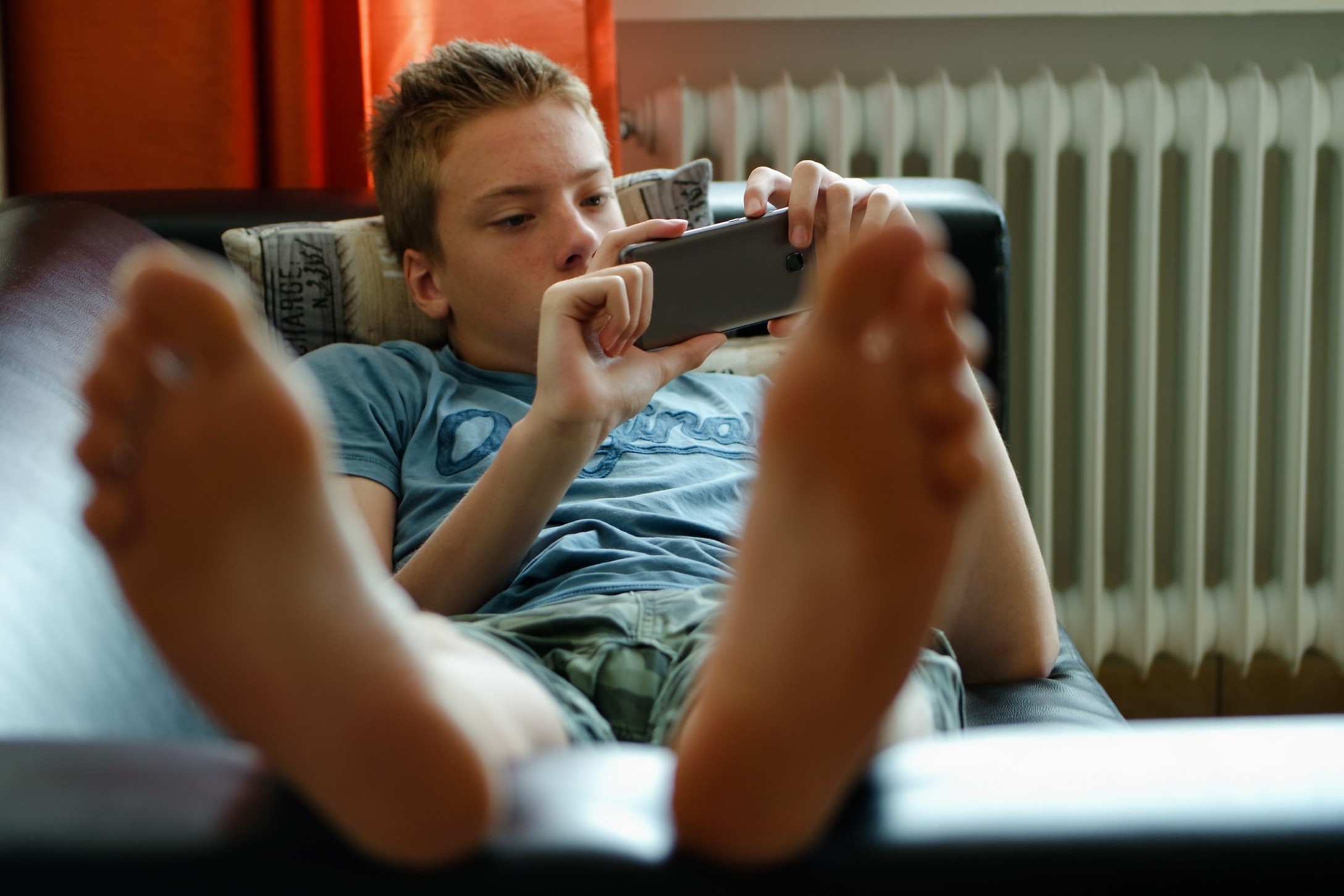 teenager-boy-laying-on-the-couch-and-using-mobile-phone_t20_V7ZNR7-2.jpg teenager-boy-laying-on-the-couch-and-using-mobile-phone_t20_V7ZNR7-2.jpg
